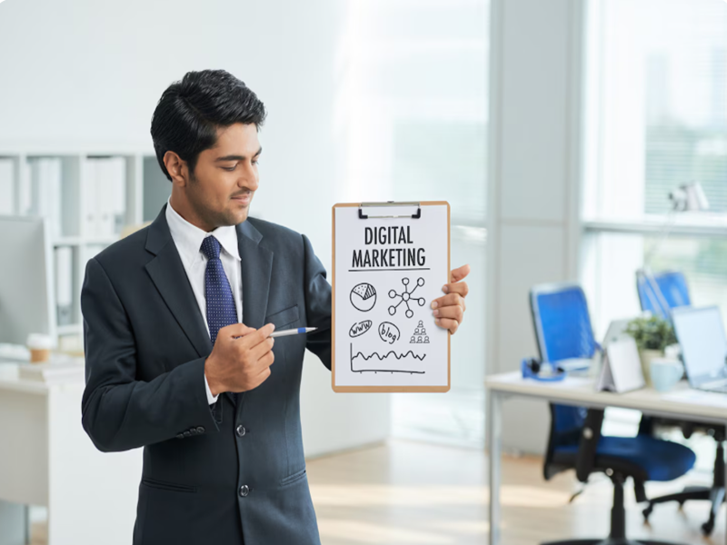 Professional digital marketing team discussing SEO, social media marketing, branding, and lead generation strategies at Extensile Media, helping businesses grow their online presence.